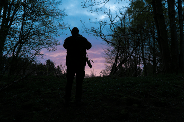 Silhouette of man out in the field